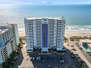 Aerial view featuring a beach view and a water vie