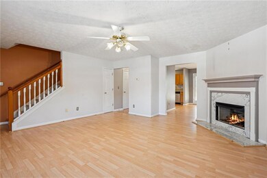 Unfurnished living room with a premium fireplace, 