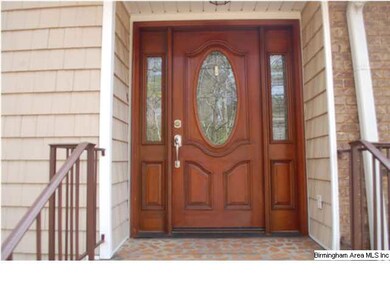 Beautiful front door with leaded glass welcomes yo