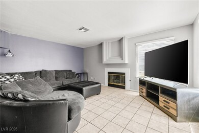 Living area featuring light tile patterned floors