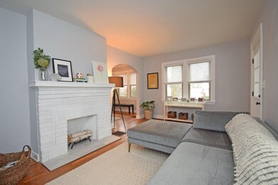 The bright and inviting living room boasts an abun