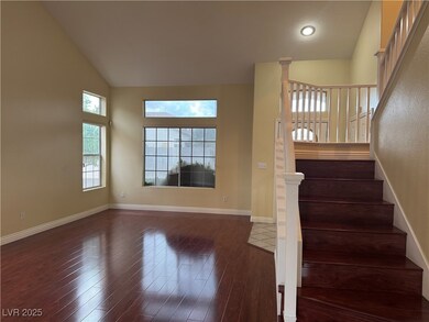 Stairs with wood finished floors, baseboards, and