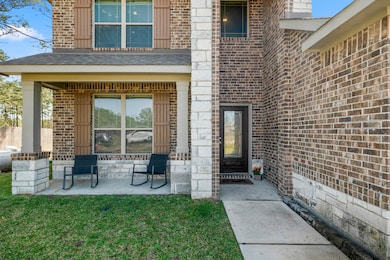 The welcoming front porch offers a perfect spot to