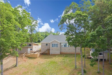 To the left you will see your private boat ramp with a drive thru garage.  To the right you can see the gardening cabin which would make a great sleeping cabin.