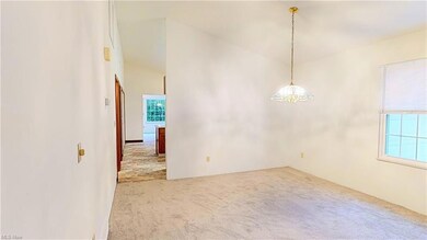 Living/dining room combo with sloping ceilings