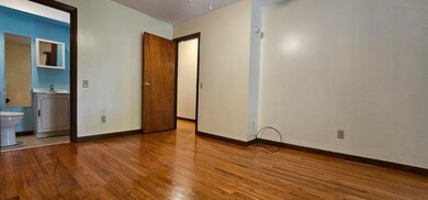05. Primary Bedroom with Half Bath