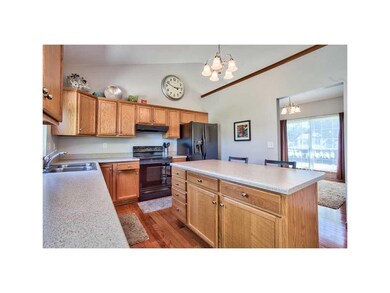 Kitchen. UPGRADED FLOORING FLOWING FROM THE KITCHE