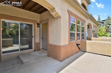Entrance to property with a patio area