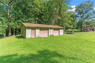Garage featuring a yard