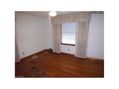 First floor bedroom 1. Note hardwood floors!