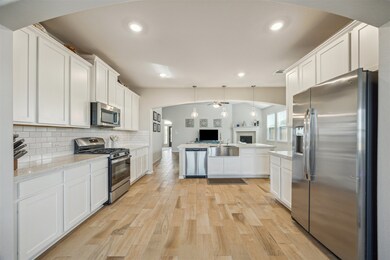 This kitchen features a modern open-plan layout wi