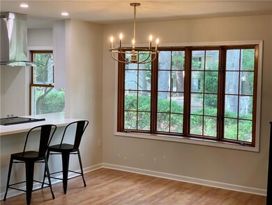 Counter-height bar and a dining table under the be