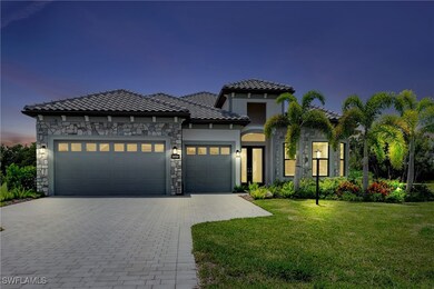 Night view of of luxurious stone accent home with
