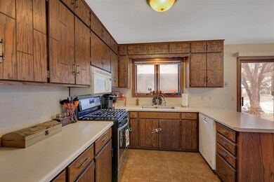 The kitchen is spacious and has lots of cabinets