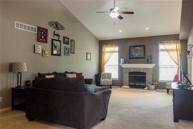 The large vaulted living room features a gas firep