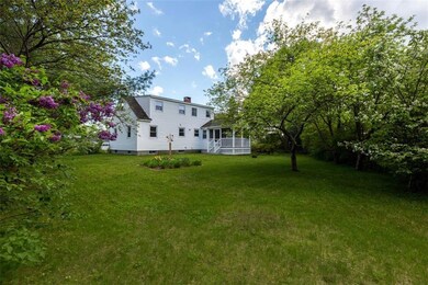 Level fenced in yard adorned with...