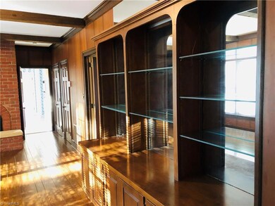 Family Den has built-in bookcases and wet bar