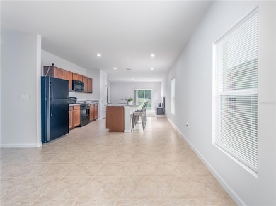 Dining, kitchen, and living room combo