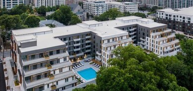 View of urban area with a pool and apartment complex