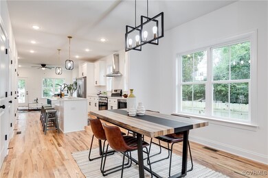 Dining space featuring sink, ceiling fan, and a we