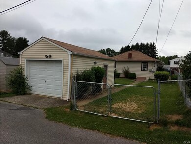 One car garage with room to park another vehicle i