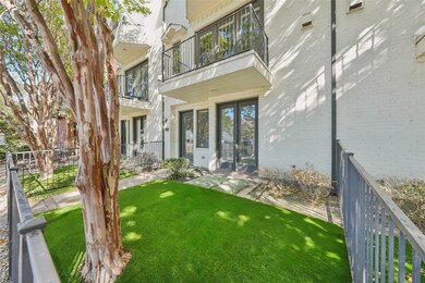 Entrance to property with a patio and brick siding