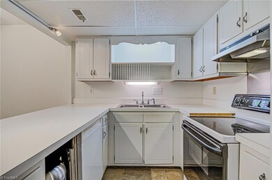 Good sized kitchen with lots of cabinets and counterspace.