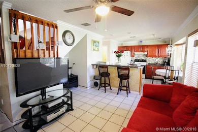 Living room which connects to the open kitchen.  L