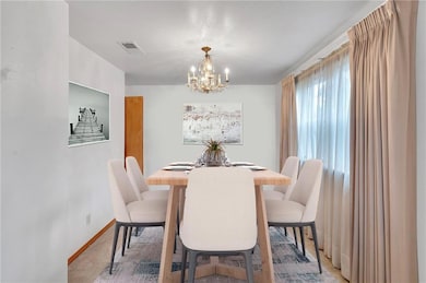 Lots of Light in the Dining Area with a double window. Great for Special Occasions. Staged.