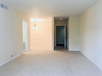 Living area looking toward entry hall and dining room