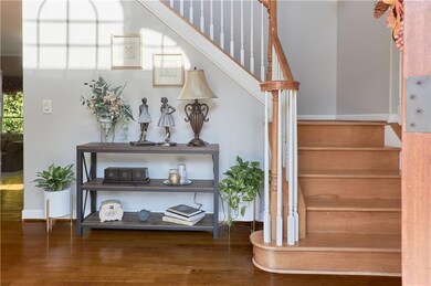Stairs featuring baseboards and wood finished floo