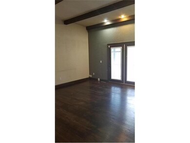 Great room - 12 foot ceilings - wood floors.  Atri