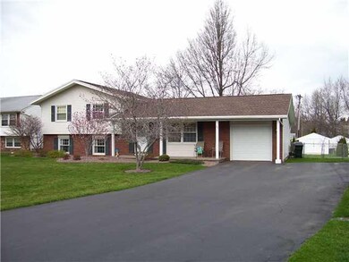 Exterior Front. The Huge Double-wide Driveway with