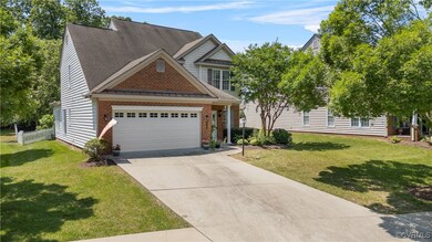View of front of house featuring a garage, concret
