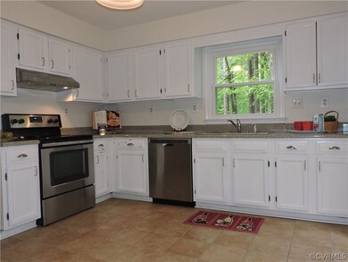 Kitchen, stainless appliances, tile floor