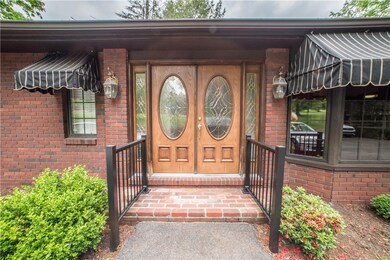 Double-door entry and awnings are very invite gues