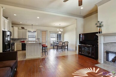 Open living area with wood floors in living room