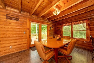 Spacious dining room with new flooring, plenty of natural light an access to the deck!