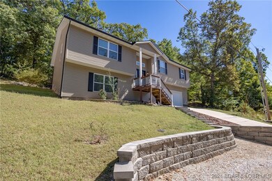 Front view of home. Parking below.