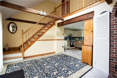 Beams and a vaulted ceiling add...