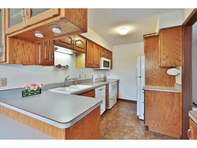 Spacious kitchen with lots of cabinets and breakfa