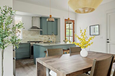 Dining space with light wood-style flooring, heal