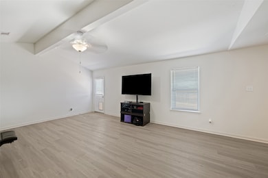 Open living area with vaulted ceiling detail, fresh interior paint, 2
