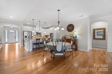 Bright, seamless flow from kitchen to dining is ideal for gatherings