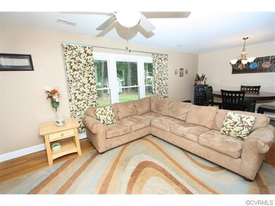 Hardwood floors, open to the kitchen.