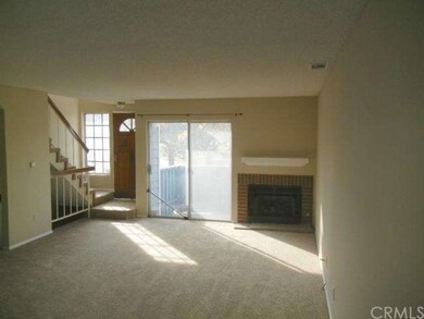 Huge living room has a fireplace, room to entertai