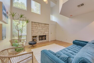Living area featuring a high ceiling, plenty of n
