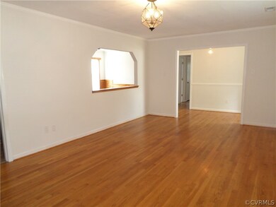 Large living room with hardwood floors, new paint