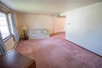 THE LIVING ROOM IS VERY SPACIOUS, AND FEATURES A L