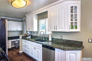 Thomasville kitchen with granite counters and...
